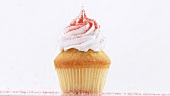Cupcake with cream topping and coloured sugar
