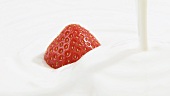 A strawberry in cream