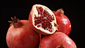 Pomegranates, whole and cut open