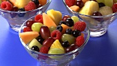Pouring cream over fruit salad