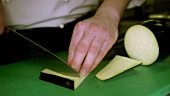 Chef dicing aubergine