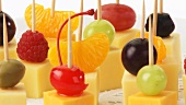 Cheese, fruit and olives on cocktail sticks