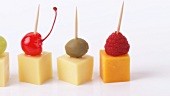 Cheese, fruit and olives on cocktail sticks