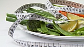 Assorted vegetables with tape measure