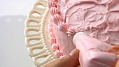 Decorating a strawberry cream cake