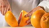 Halving and squeezing a blood orange