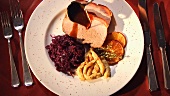 Roast pork with red cabbage, spaetzle noodles and sauce