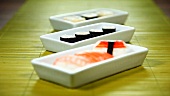 Three dishes of sushi