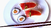 Maki sushi and nigiri sushi on plate