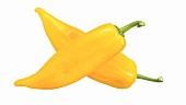 Two yellow pointed peppers