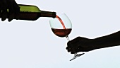Pouring a glass of red wine