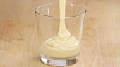 Zabaione being poured into a glass