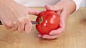 Cutting the stalk and core out of tomato