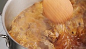 Stirring beef goulash