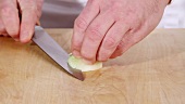 A onion being diced