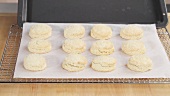 Baked scones being transferred to a wire rack