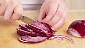 Red onions being sliced