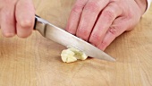 Garlic being sliced