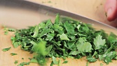 Parsley leaves being chopped