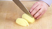 A potato being diced