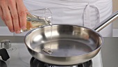 Heating oil in a frying pan
