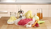 Ingredients for cottage pie (British minced meat bake topped with mashed potatoes)