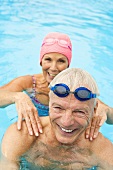 Germany, Senior couple in swimming pool