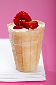 Vanilla ice cream with strawberries, close-up
