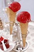 Raspberry ice cream in ice cream cones
