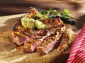 Grilled Porterhouse steak with herb butter