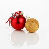 Two different Christmas baubles (red and gold)