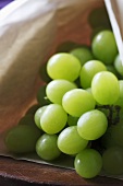 A Bunch of Green Grapes in Paper Bag