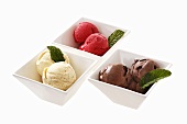 Various flavours of ice cream (chocolate, cherry, vanilla)