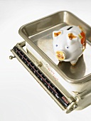 Piggy bank on kitchen scales