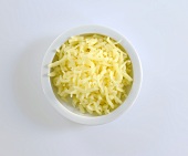 A dish of grated cheese (overhead view)