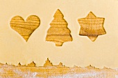 Biscuit dough with the shapes of cut-out biscuits