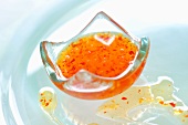 Sweet and sour sauce in a small glass dish
