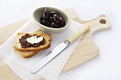Tapenade and soft cheese on toast