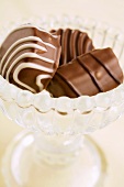 Chocolate pralines in a glass bowl