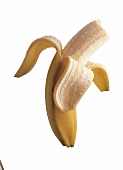 Zur Hälfte geschälte und oben angebissene Banane