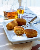 Croquettes of risotto rice on serving dish