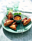 Glazed chicken wings with mango chilli sauce on plate