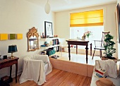 View of room with table, chair and wooden floor