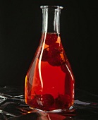 Bottle of raspberry vinegar with fruits