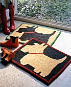 Doormat with dog motif and shoes on floor