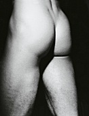 Close-up of buttocks and thighs of a man, black and white