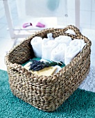Close-up of wicker basket with towels and cloths