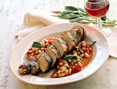 Tuscan pork fillets on plate served with red wine