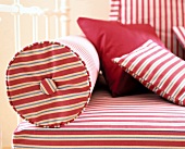 Close-up of red and white striped pattern cushion