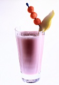 Glass of pear, watermelon, milk and yogurt drink on white background